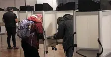  ?? MATT STONE / HERALD STAFF ?? MAKING THEIR PICKS: People vote during the primary election at Boston City Hall on Tuesday.