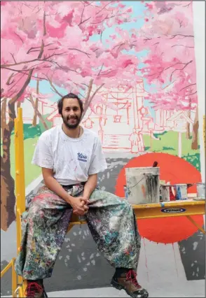  ?? The Sentinel-Record/Richard Rasmussen ?? CHERRY BLOSSOMS: Italian artist Pepe Gaka with his latest Hot Springs mural, which shows Hanamaki, Japan, during spring, and is a companion piece to the mural depicting Hanamaki during winter.