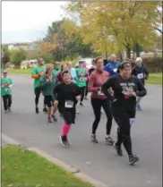  ?? CHARLES PRITCHARD - ONEIDA DAILY DISPATCH ?? People run down Seneca Street during the 5K Run for Jessica’s Heroes on Saturday, Oct. 20, 2018.