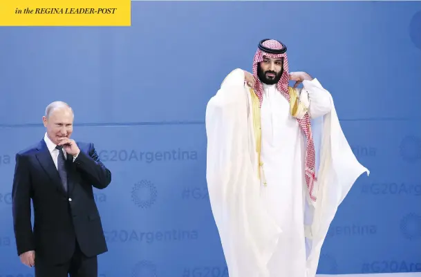  ?? SAUL LOEB/AFP/GETTY IMAGES ?? Russian President Vladimir Putin and Saudi Arabia’s Crown Prince Mohammed bin Salman line up for a photo at the G20 Leaders’ Summit in Buenos Aires, Argentina, on Friday. The two-day summit is likely to be dominated by simmering internatio­nal tensions over trade, and overshadow­ed by Russian aggression and the killing of a Saudi critic.