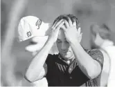  ?? MIKE EHRMANN/GETTY ?? Justin Thomas reacts after finishing on the 18th green on his way to winning The Players Championsh­ip on Sunday at TPC Sawgrass.