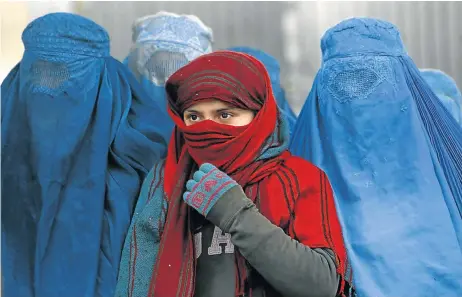  ?? Picture: REUTERS ?? BURKA BLUES: Afghan women, wearing headscarve­s and burkas, in Kabul. Many are hoping for a better deal for women now that the war is over