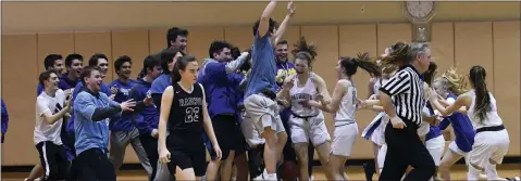  ?? MICHAEL REEVES — FOR MEDIANEWS GROUP ?? Great Valley students storm the court to celebrate Tuesday’s semifinal win over Radnor.