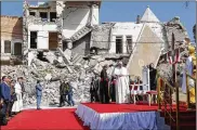  ?? ANDREW MEDICHINI / ASSOCIATED PRESS ?? Pope Francis, surrounded by shells of destroyed churches, arrives to pray for the victims of war at Hosh alBieaa Church Square on Sunday in Mosul, Iraq, once the de-facto capital of IS.