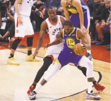  ?? Scott Strazzante / The Chronicle ?? Warriors forward Kevin Durant injures his Achilles tendon early in the second quarter of Game 5 of the NBA Finals.