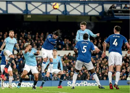  ??  ?? Aymeric Laporet’s first-half header and Gabriel Jesus’ goal deep in injury time guided Manchester City to a 2-0 victory over Everton at Goodison Park yesterday.
