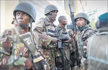  ?? Dai Kurokawa
European Pressphoto Agency ?? SOLDIERS PREPARE to enter a building at Garissa University College. The killing of Christian students was designed to raise tension between the nation’s Muslim and Christian population­s, analysts said.