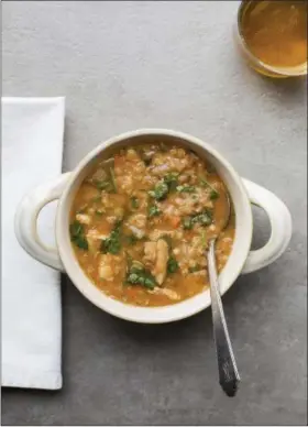  ?? SARAH E CROWDER VIA AP ?? Red lentil and chicken slow-cooker soup is thick from the lentils, and fragrant with cumin and coriander.