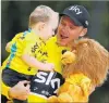  ?? PHOTO: GETTY IMAGES ?? Chris Froome celebrates with son Kellan after winning the Tour de France yesterday.