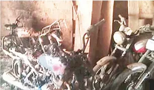  ??  ?? Some of the motorcycle­s burnt during the attack on Tawari village of Kogi local government area of Kogi state on Friday