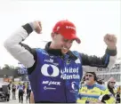  ?? Carlos Osorio / Associated Press ?? Graham Rahal exits his car after winning the first race of the IndyCar Detroit Grand Prix doublehead­er.