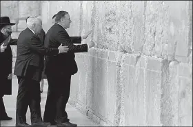  ?? AP/ABIR SULTAN ?? Secretary of State Mike Pompeo touches the Western Wall in Jerusalem’s Old City on Thursday.