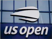  ?? AP PHOTO BY FRANK FRANKLIN II ?? The U.S. Open logo is shown on the Arthur Ashe Stadium at the USTA Billie Jean King National Tennis Center in this Thursday, Aug. 27, 2020, file photo. The two singles champions at this year’s U.S. Open each will earn 35% less than in 2019, the last time the Grand Slam tennis tournament allowed spectators, while prize money for qualifying and the first three rounds of the main draw will rise as part of an overall increase.