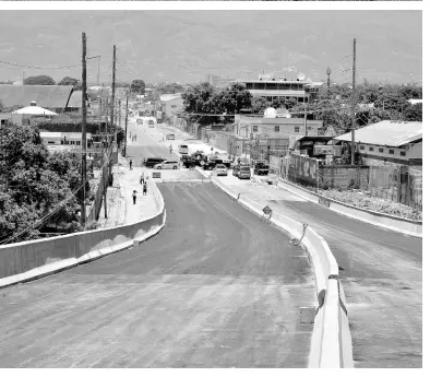  ??  ?? AT RIGHT: Roadwork is progressin­g on the Hagley Park Road as the Government upgrades the throughfar­e from Three Miles to Half-Way Tree in St Andrew.