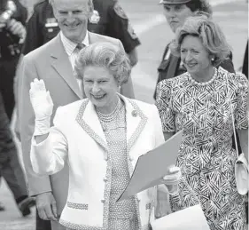  ?? Staff file photo ?? Queen Elizabeth II waves to the crowd in Houston as she walks to her airplane at Ellington Field on May 23, 1991. She had the power to comfort amid global crises.