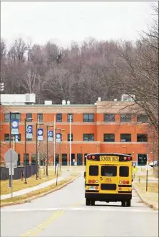  ?? Cassandra Day / Hearst Connecticu­t Media ?? A school bus on the way to Middletown High School.