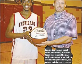  ?? SAM COSTANZA ?? Fannie Lou Hamer coach Marc Skelton (r.) presents team star Isaiah Thomas with commemorat­ive ball to acknowledg­e senior’s 1,000 career points.