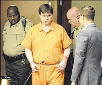  ?? BOB ANDRES /BANDRES@AJC.COM ?? Justin Ross Harris enters court for sentencing Monday. He declined the opportunit­y to speak on his own behalf before Judge Mary Staley Clark sentenced him to life in prison for killing his 22-month-old son Cooper.