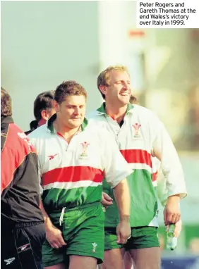  ??  ?? Peter Rogers and Gareth Thomas at the end Wales’s victory over Italy in 1999.