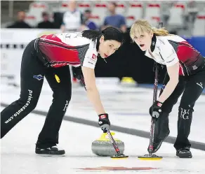  ?? JIM WELLS / POSTMEDIA NEWS FILES ?? Jill Officer, left, with Dawn Mcewen, hasn’t been able to quit the sport outright — she’s filled in at times this past year for other members of Jennifer Jones’ rink.