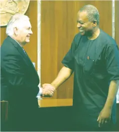  ?? — Reuters photo ?? Tillerson and Nigeria’s Foreign Minister Geoffrey Onyeama shake hands after their news conference in Abuja, Nigeria.