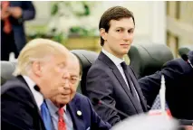  ??  ?? FILE PHOTO - White House senior advisor Jared Kushner (C) sits alongside US President Donald Trump (L) and Commerce Secretary Wilbur Ross (2nd L) May 20. REUTERS/Jonathan Ernst