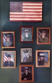  ?? MEDIANEWS GROUP PHOTO ?? Mary Jo Lester calls this her “military wall” in her Norristown home. The photos honor her brother Daniel, her children Kathleen, Rebecah and Danny, and “grands” Laura, Gregory and Molly, who have proudly served the country.