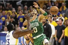  ?? JED JACOBSOHN / AP ?? Boston Celtics forward Jayson Tatum (0) loses the ball while being defended by Golden State Warriors forward Draymond Green (23) and guard Stephen Curry during the second half of Game 2 of the NBA Finals in San Francisco, Sunday.