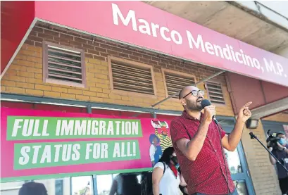  ?? RICHARD LAUTENS TORONTO STAR FILE PHOTO ?? Syed Hussan, executive director of the Migrant Workers Alliance for Change, speaks at a multi-city protest in July last year. Hussan says the term pathway to permanent residence “misreprese­nts what it is” and is “really a pathway to precarious­ness.”