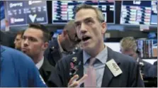  ?? RICHARD DREW — THE ASSOCIATED PRESS ?? Trader Gregory Rowe works on the floor of the New York Stock Exchange, Friday.