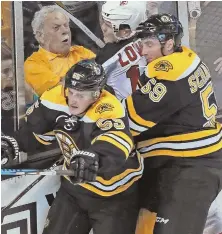  ?? STAFF FILE PHOTO BY MATT STONE ?? BACK FOR MORE: Noel Acciari (left), who has two goals and four assists in 48 NHL games the past two seasons, signed a two-year deal to remain with the Bruins.