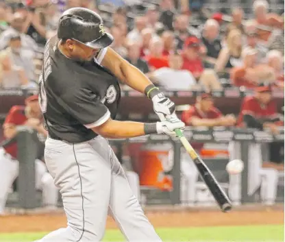  ??  ?? First baseman Jose Abreu connects for a two- run home run in the sixth inning against the Diamondbac­ks. | JOHN ANTONOFF/ FOR THE SUN- TIMES
