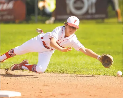  ?? Brian A. Pounds / Hearst Connecticu­t Media ?? Fairfield American shortstop Pierce Cowles dives for a ground ball in the first inning of his team’s 11- 9 defeat of Manchester National to win the Little League state championsh­ip July 29 at East Lyme Field in Niantic.