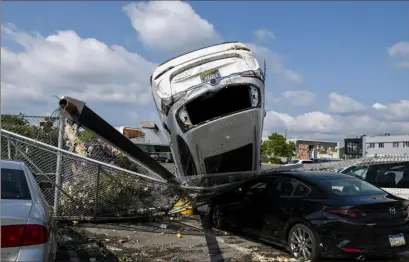  ?? Joe Lambert /Camden Courier-Post via AP ?? The aftermath of a tornado in Bensalem, Pa.