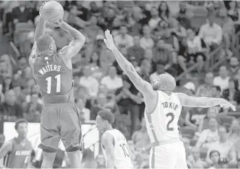  ?? ALAN DIAZ/AP ?? Miami guard Dion Waiters (11) shoots as Toronto forward P.J. Tucker (2) on Saturday in Miami.