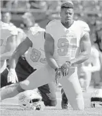  ?? STEVEN SENNE/AP ?? Miami Dolphins defensive end Cameron Wake warms up before a game against the New England Patriots on Sunday in Foxborough, Mass.