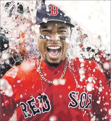  ?? ADAM GLANZMAN Getty Images ?? WITH FOUR ALL-STAR appearance­s, an MVP award and the 2018 World Series championsh­ip in Boston, Mookie Betts cemented himself as one of baseball’s elite players before being traded to the Dodgers.