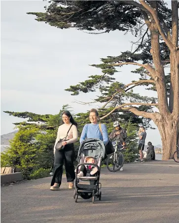  ?? KARL MONDON/STAFF ?? Hikers and cyclists share a steep trail above the cliffs of San Francisco’s Fort Mason. The trail is one of the shortest but most spectacula­r sections of the San Francisco Bay Trail.