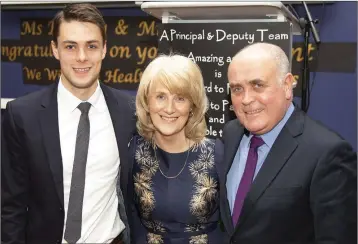  ??  ?? Retiring Deputy Principal Carol Buckley with her son Conor and husband Billy.