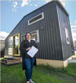  ?? JOHN BISSET/STUFF ?? Jacqui Barnes has been living in her tiny house for 12 months and says she wouldn’t have it any other way.