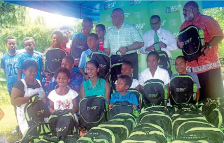  ?? Photo: ?? Back from right: FENC Fiji National Coordinato­r John Tuiono, Retail Bank General Manager Ravindra Singh and BSP Human Resources General Manager Howard Politini Snr with children under the Foundation for the Education of Needy Children programme on...