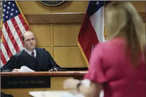  ?? (AP/Alyssa Pointer) ?? Ashleigh Merchant, attorney for Michael Roman, sits in front of Fulton County Superior Judge Scott McAfee in the case of State of Georgia v. Donald John Trump Monday in Atlanta.