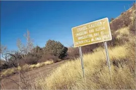  ?? Carolyn Cole Los Angeles Times ?? NOT FAR from the Krentz ranch, a sign warns of illegal activities related to the border. “When we asked for safety, we were described as racist,” Sue Krentz says.