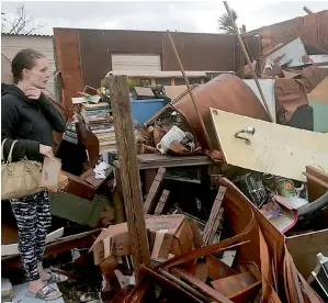  ?? AP ?? Haley Nelson inspects damages to her family properties in the Panama City, spring field area after Hurricane Michael made landfall in Florida’s Panhandle. —