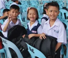  ??  ?? File photo shows pupils and their new school bags.