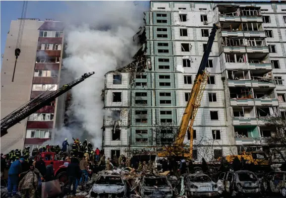 ?? Photo: AP/Bernat Armangue. ?? Firefighte­rs work to extinguish a fire after a Russian attack at a residentia­l building in Uman, central Ukraine, Friday, April 28, 2023.
