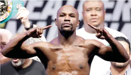  ?? AP FOTO ?? SURE WINNER. Boxing pundits expect Floyd Mayweather Jr. to be laughing his way to the bank after the Aug. 26 spectacle.