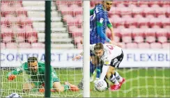  ??  ?? CLOSE CALL: Millwall’s Tom Bradshaw sees the ball go inches wide