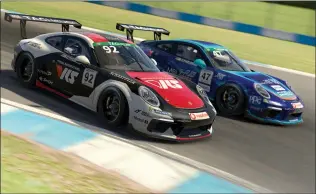  ?? Clive Rose
/ Getty Images /TNS ?? From an image computer generated in-game, Joshua Rogers of Australia and VRS Coanda Simport passes Alejandro Sanchez of Spain and MSI esports for second position during the feature race in Roundthree of the Porschetag Heuer Esports Supercup run at Donnington Park on May 23, 2020, in Donnington, United Kingdom.