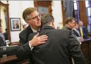  ?? JAY JANNER / AMERICAN-STATESMAN ?? Lt. Gov. Dan Patrick (left) hugs Scot Rice during a discussion about guns in schools at the Governor’s Reception Room at the Capitol on Thursday. Rice’s wife, Flo Rice, was a substitute teacher who was shot at Santa Fe High School.